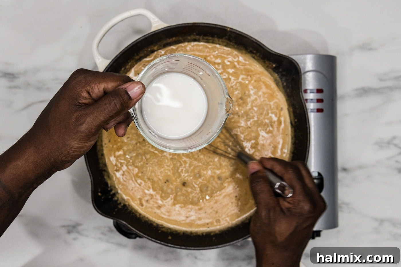 Creamy Sun-Dried Tomato Tuscan Chicken 10 whisking cornstarch slurry into tuscan chicken sauce in a skillet