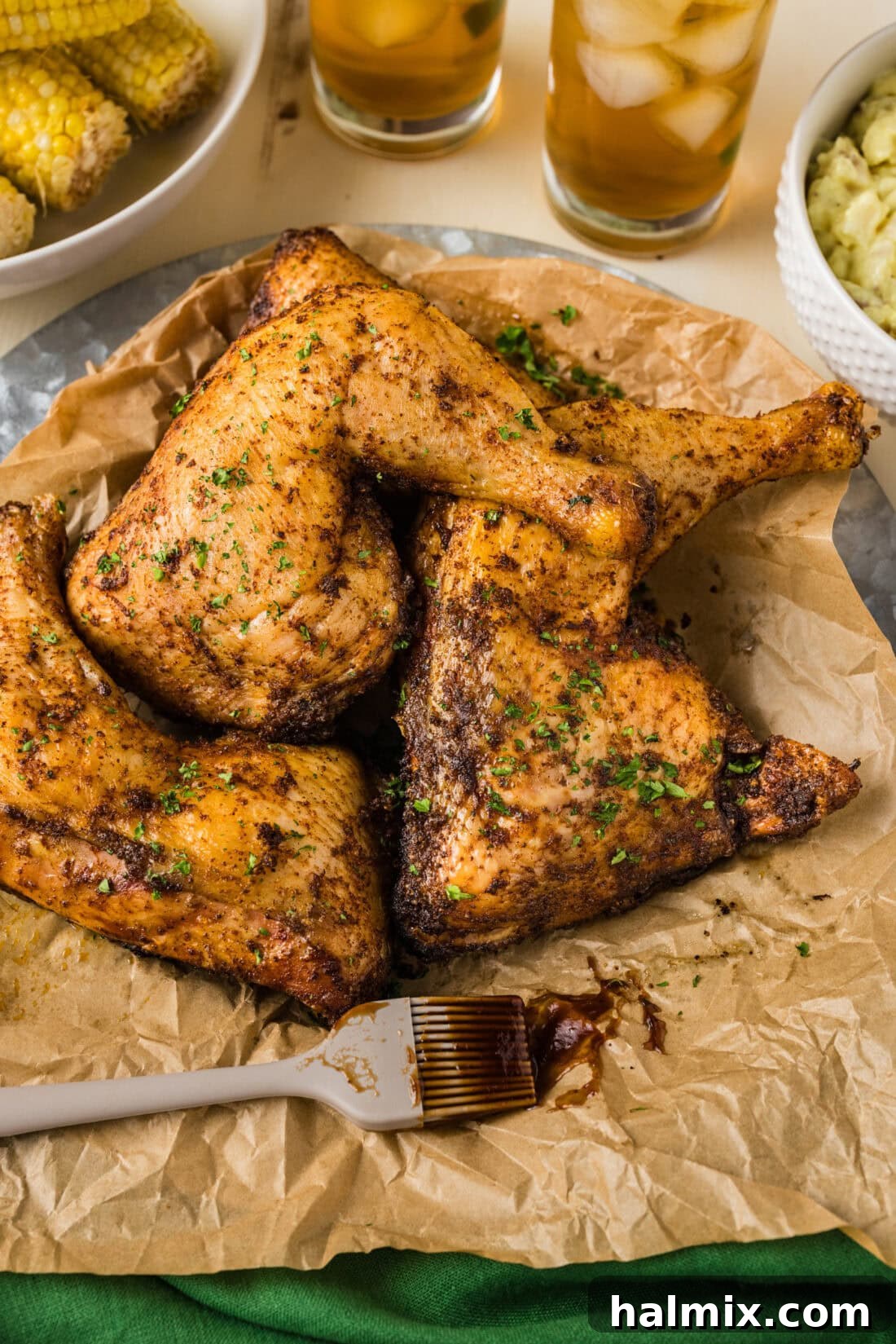 Smoked Chicken Quarters on a parchment lined platter