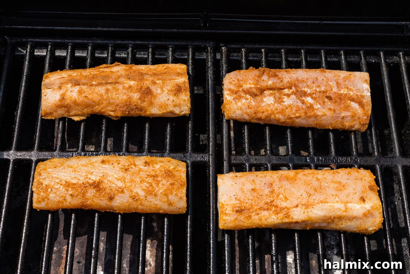 seasoned mahi mahi filets on a grill