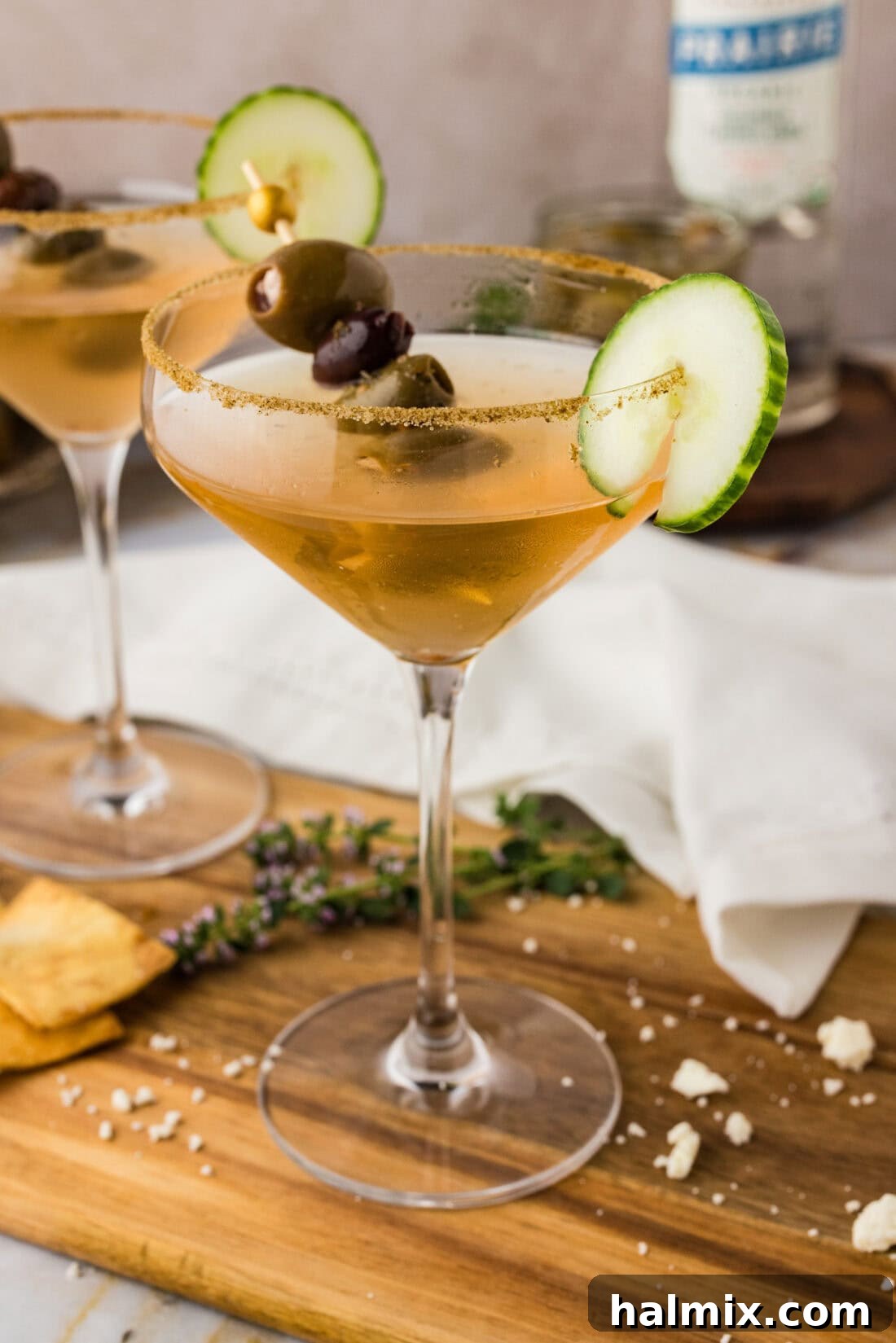 Close up photo of a Dirty Greek Martini on a wooden board