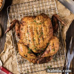 Artisan Smoked Chicken 11 Close up photo of a Smoked Chicken resting on a wire rack