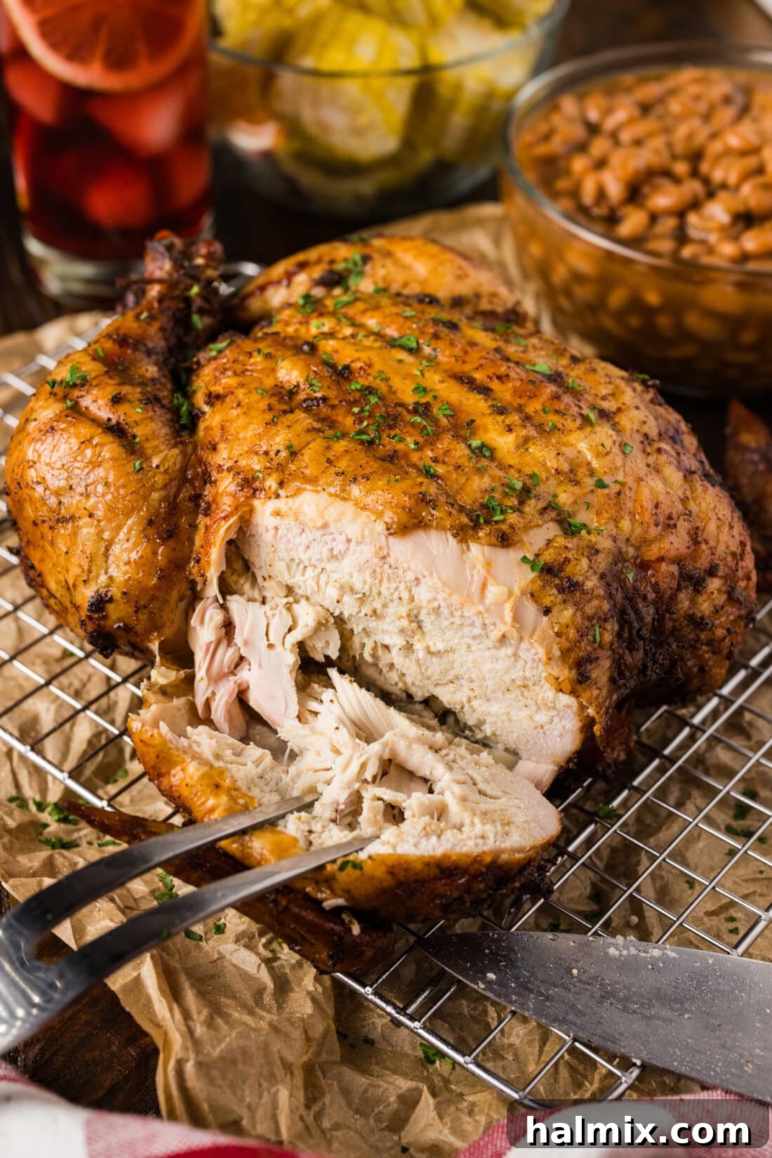 Artisan Smoked Chicken 3 Close-up photo of a Smoked Chicken with a piece cut off, highlighting the crispy skin and tender meat