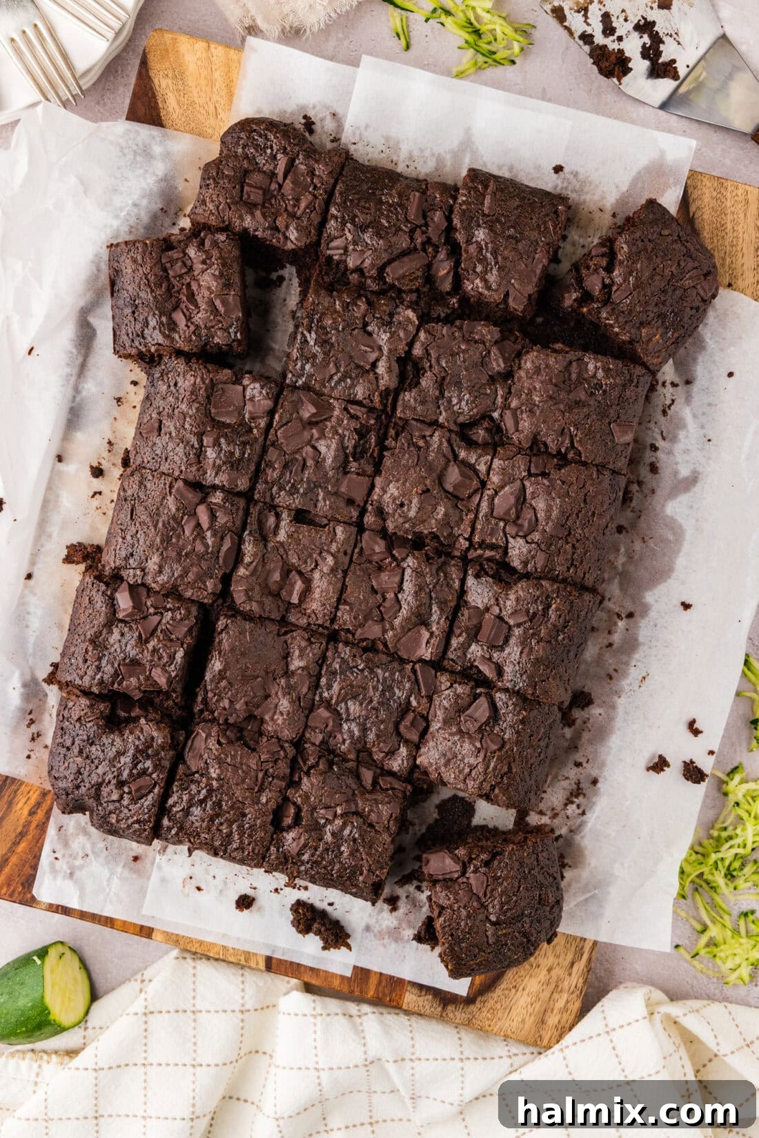 Hidden Veggie Fudge Brownies 2 Zucchini Brownies cut into squares on parchment paper