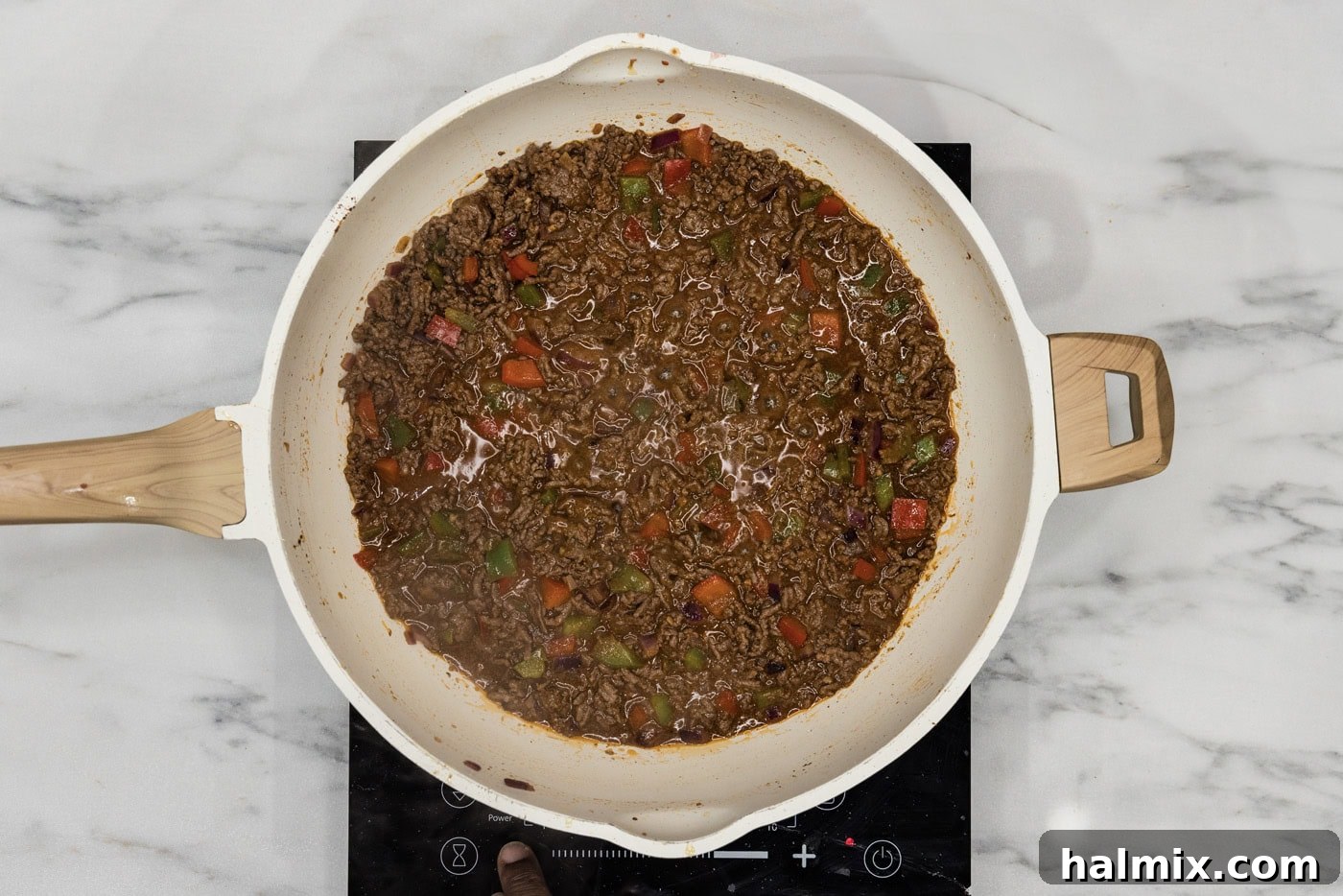 Philly cheesesteak sloppy joe mixture in a skillet