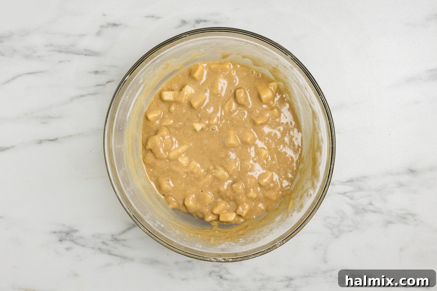Apple muffin batter in a bowl