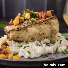 Close up photo of Grilled Chilean Sea Bass on a bed of rice