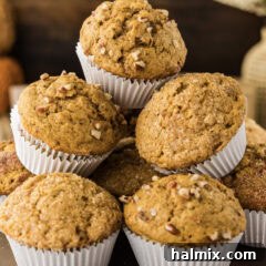 Close up photo of a pile of Pumpkin Banana Muffins