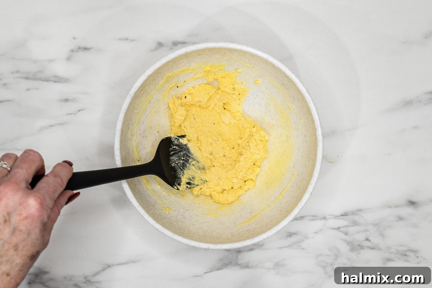 deviled eggs filling mixed together in a bowl
