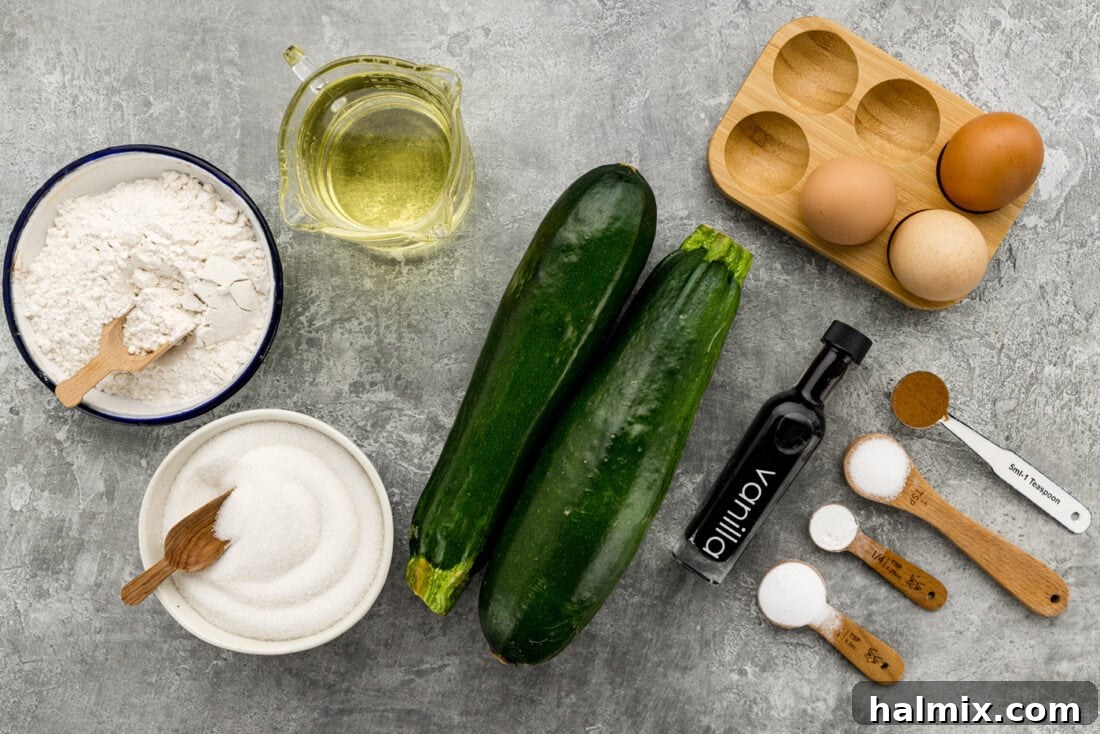 Squash Loaf 4 Assorted ingredients laid out for making Zucchini Bread, including shredded zucchini, flour, eggs, and sugar.