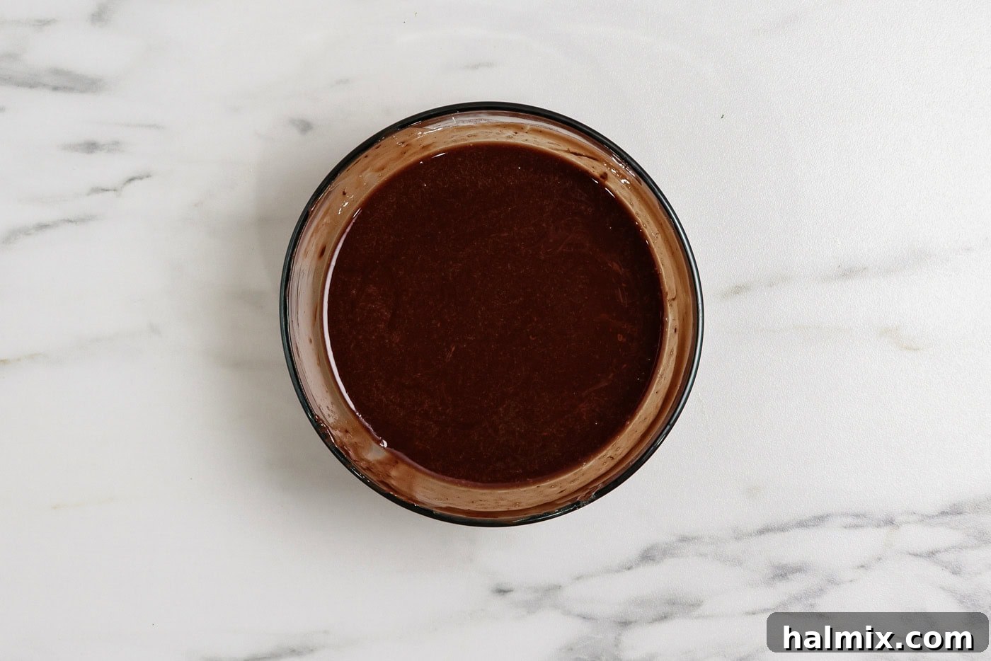 Spiced Pumpkin Swirl Brownies 7 melted chocolate and butter mixture in a bowl