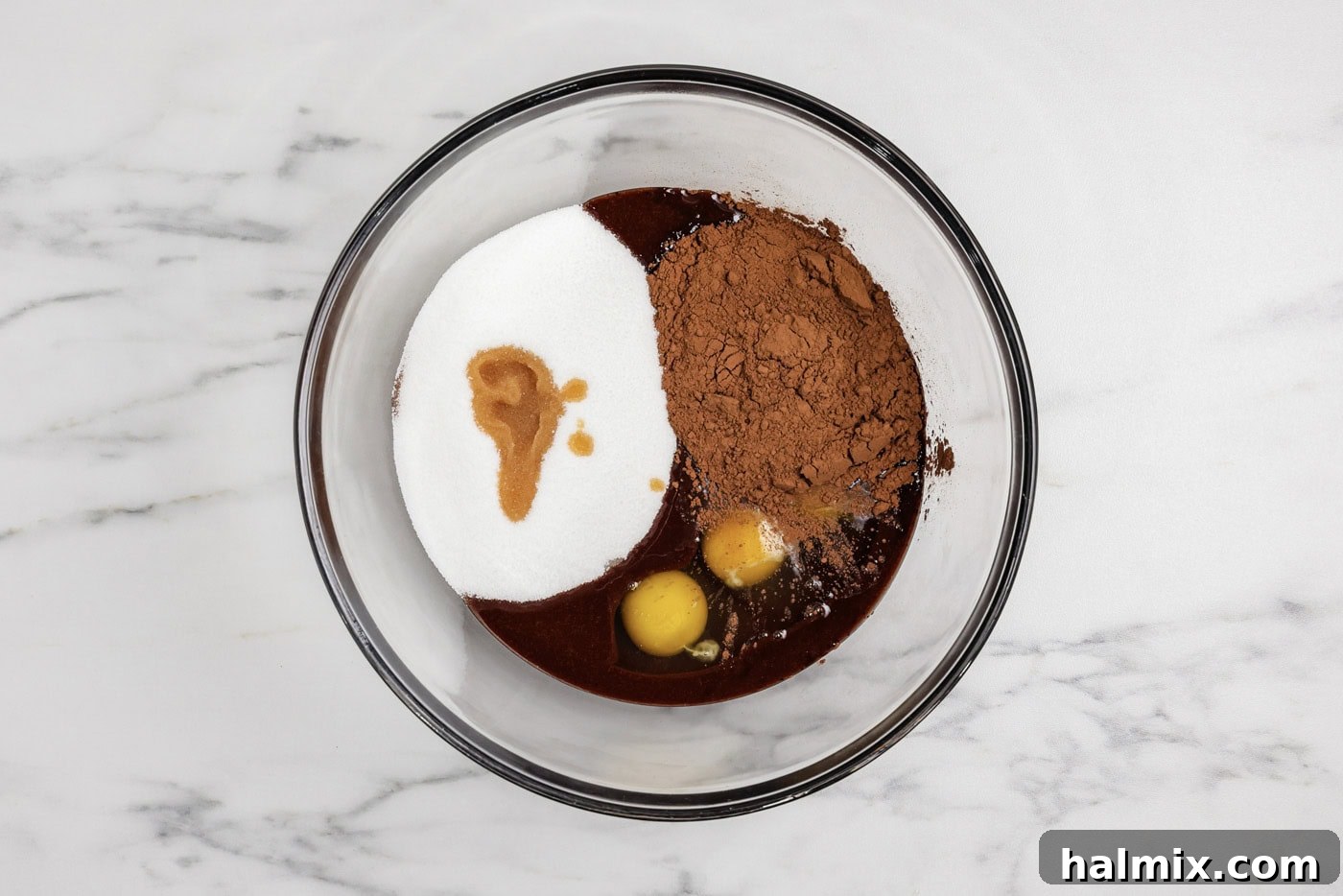 Spiced Pumpkin Swirl Brownies 8 eggs, cocoa, sugar, and vanilla added to melted chocolate in a bowl