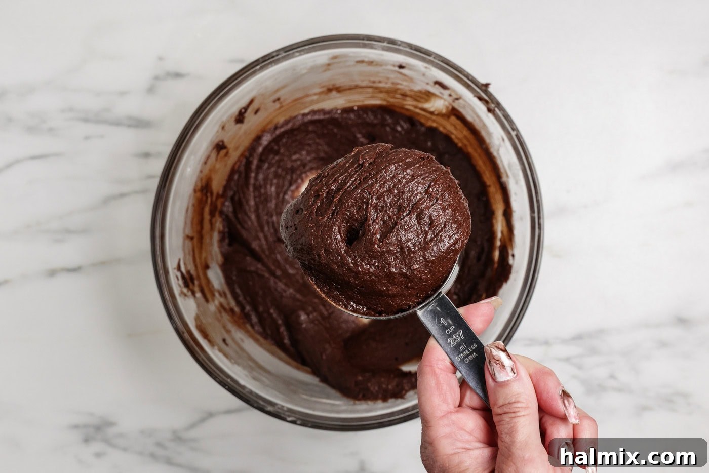 Spiced Pumpkin Swirl Brownies 10 Scooping 1 heaping cup of brownie batter with a measuring cup