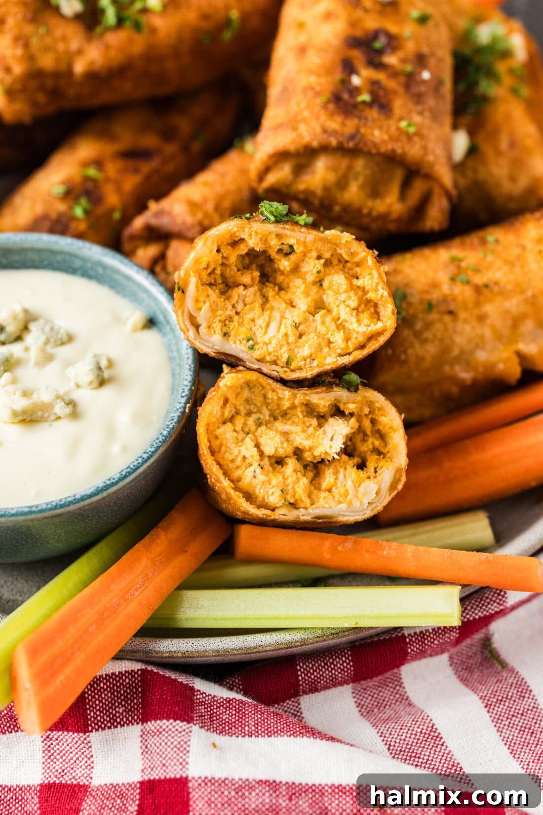 Close up photo of a Buffalo Chicken Egg Roll cut in half