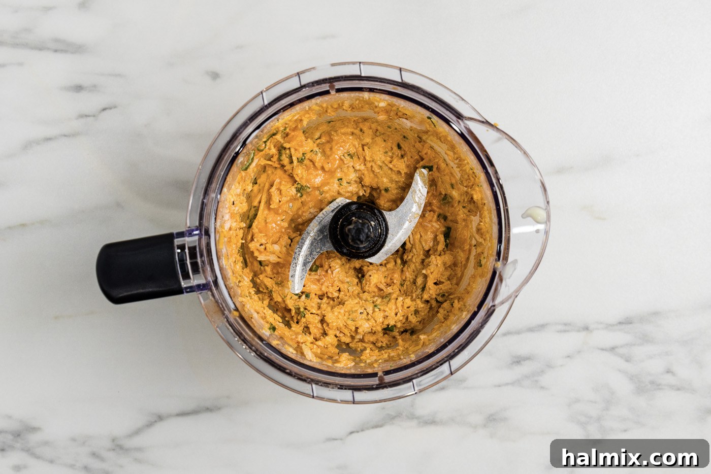 buffalo chicken mixture in a food chopper
