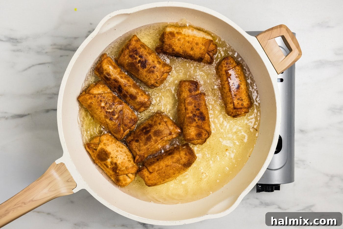 fried buffalo chicken egg rolls in oil