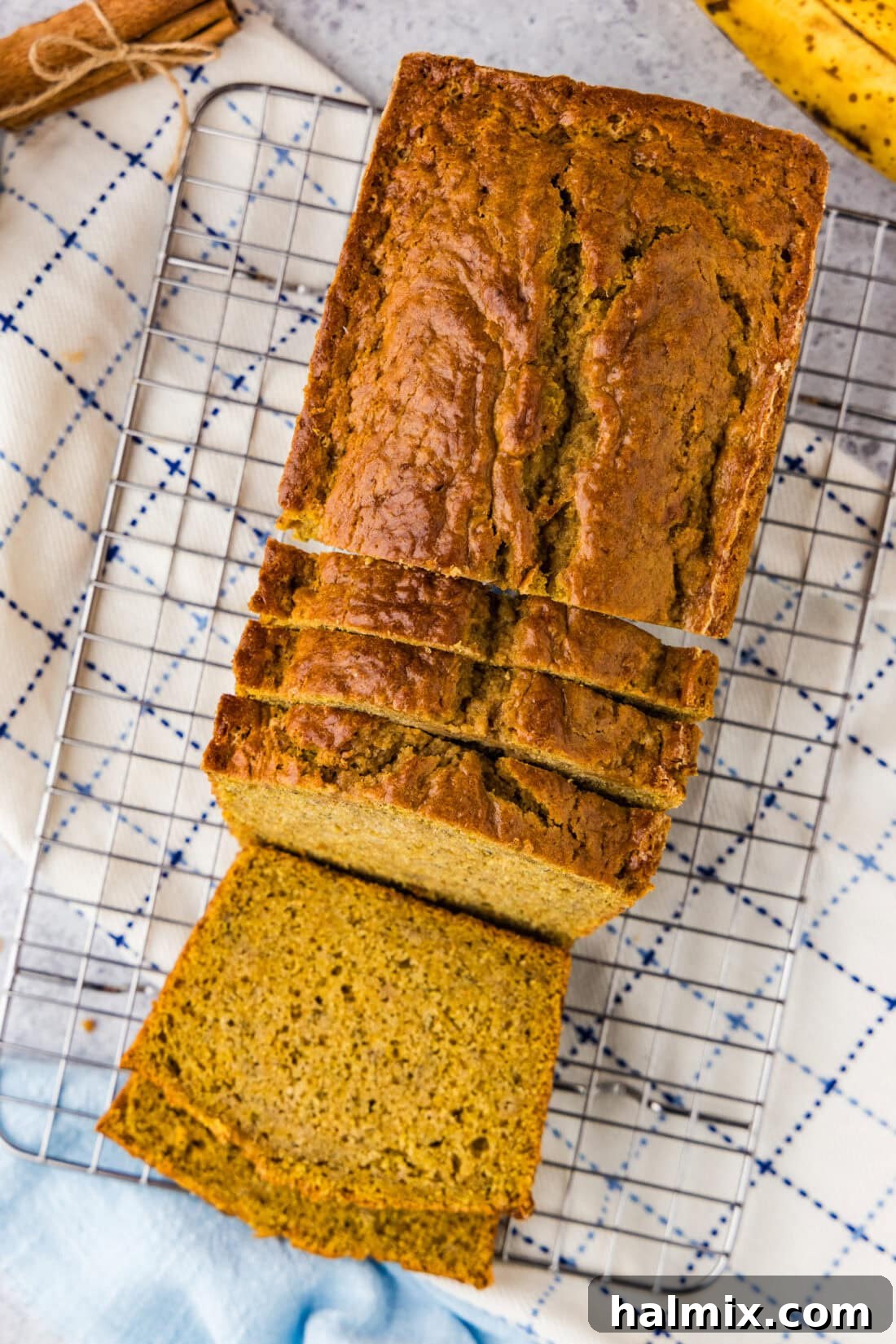 Pumpkin Banana Bread cut into slices on a wire rack