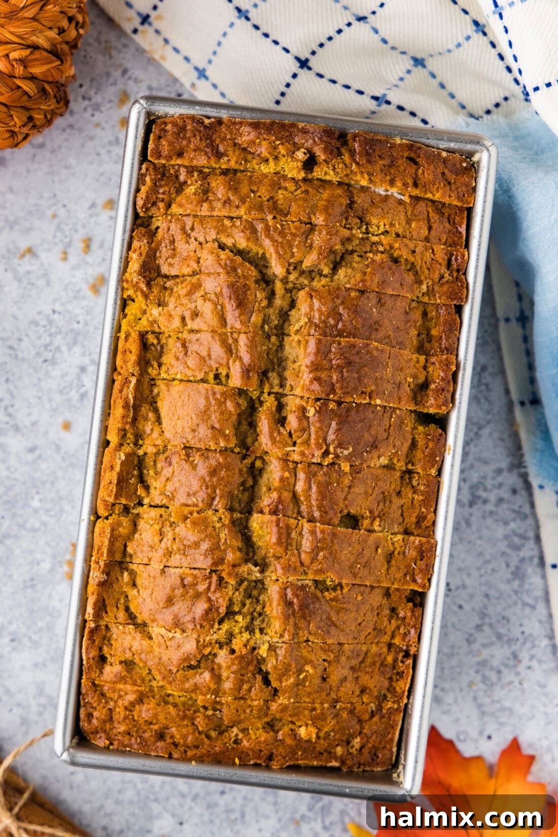 Pumpkin Banana Bread cut into slices in a loaf pan