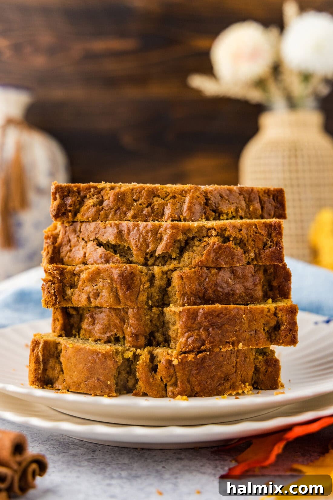 Stack of Pumpkin Banana Bread slices on a plate