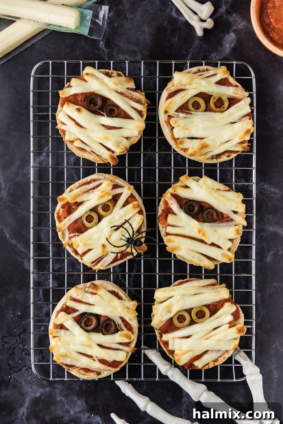 Mini Mummy Pizzas on a wire rack