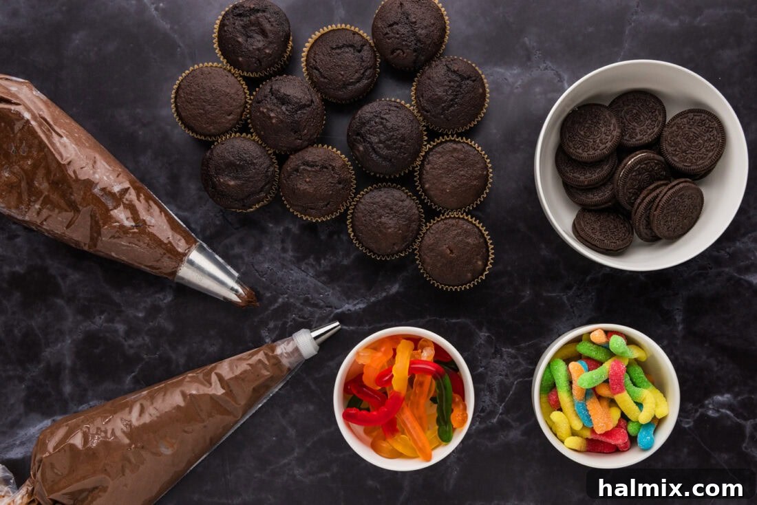 Ingredients for Halloween Dirt Cupcakes laid out on a table