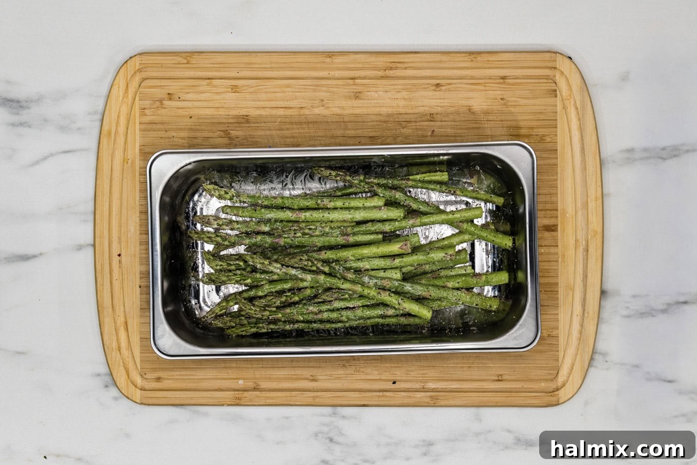 Perfect Instant Pot Asparagus 6 butter coated asparagus seasoned with garlic salt and black pepper