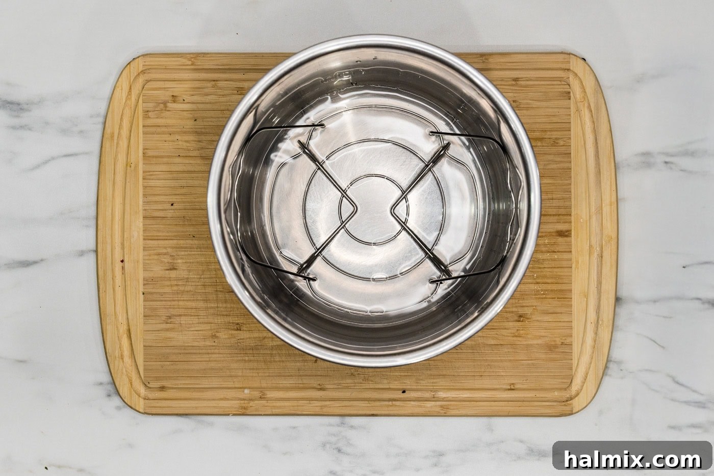 Perfect Instant Pot Asparagus 7 water in the basket of an instant pot