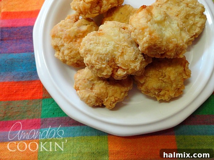 A beautifully arranged plate of freshly made homemade chicken nuggets, perfectly golden and ready to be served with your favorite dipping sauces.