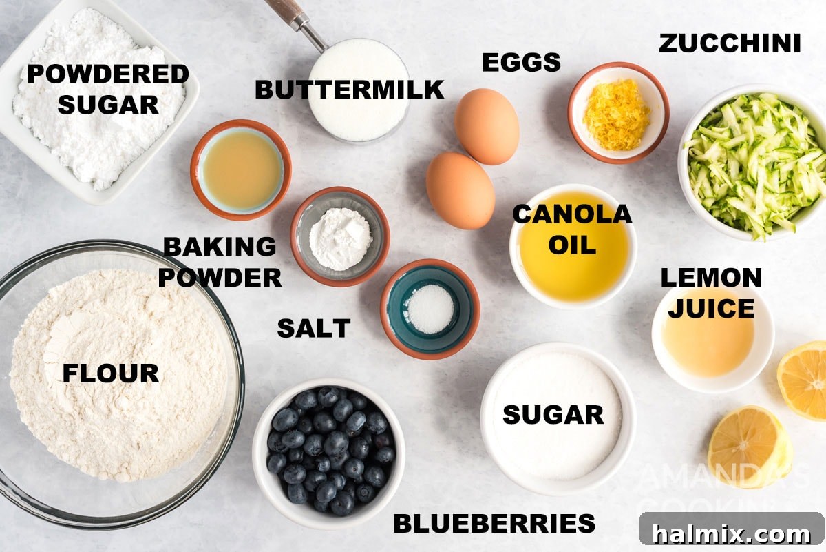 labeled ingredients for lemon blueberry zucchini bread, showing flour, eggs, oil, sugar, buttermilk, lemons, blueberries, and shredded zucchini