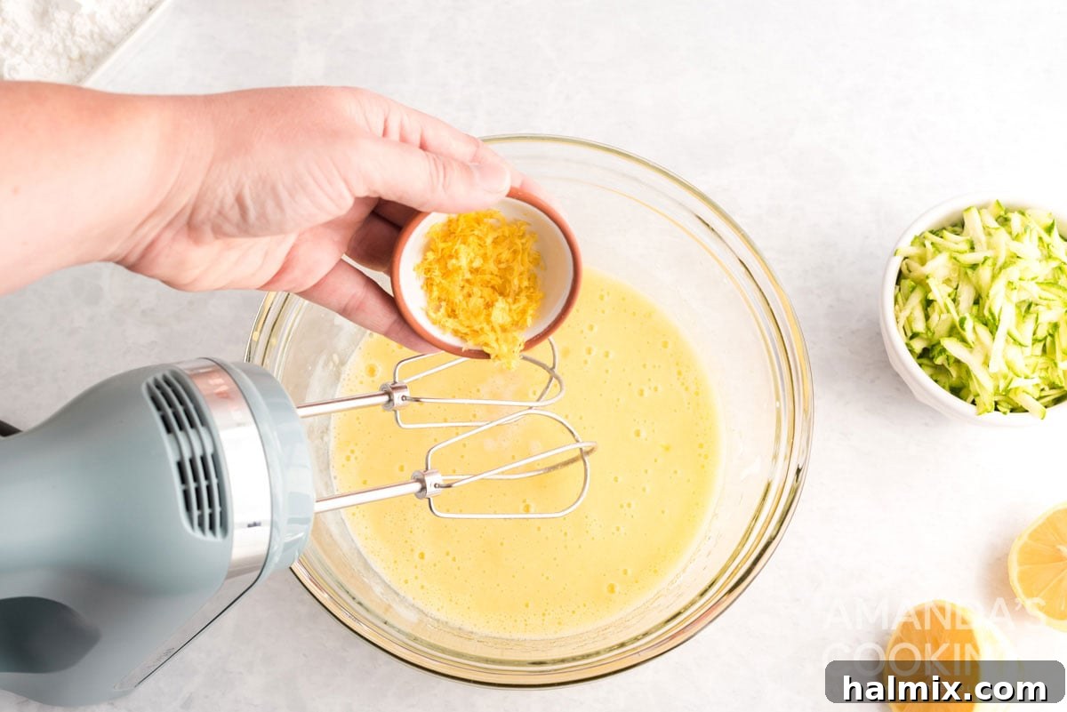 adding fresh lemon zest to the wet ingredients, enhancing the citrus aroma