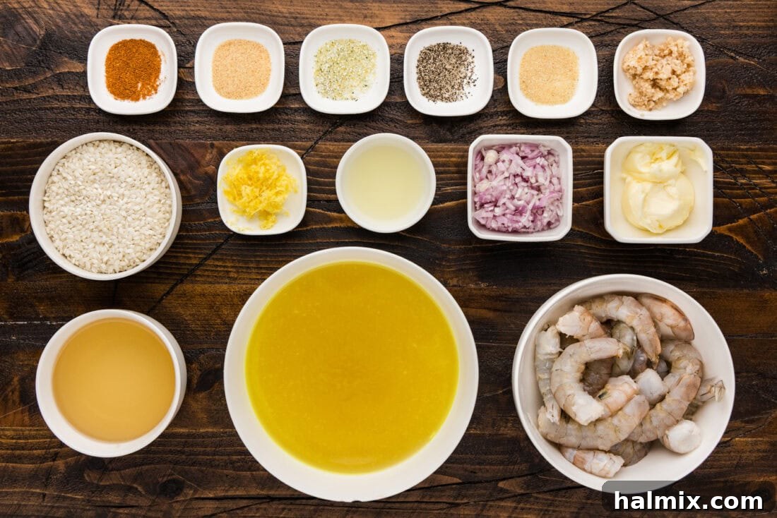 Creamy Prawn Risotto 4 A collection of fresh ingredients laid out for making shrimp risotto, including shrimp, lemon, butter, herbs, and rice.