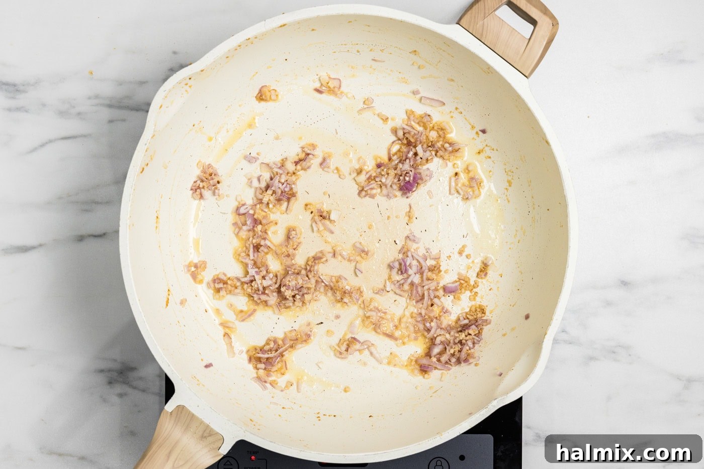 Creamy Prawn Risotto 6 Sautéed garlic and shallots in butter, softened and fragrant in a skillet.