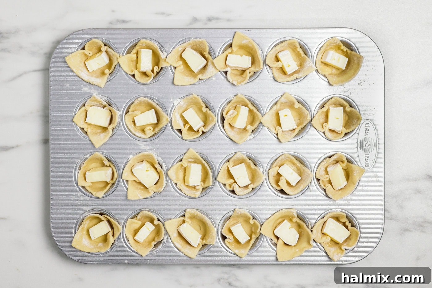 cubes of brie inside puff pastry squares