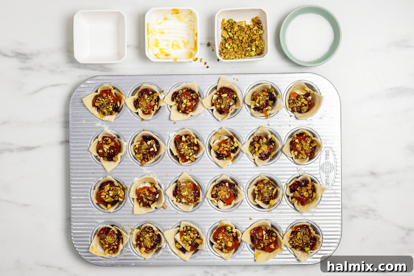 chopped pistachios added on top of brie bites