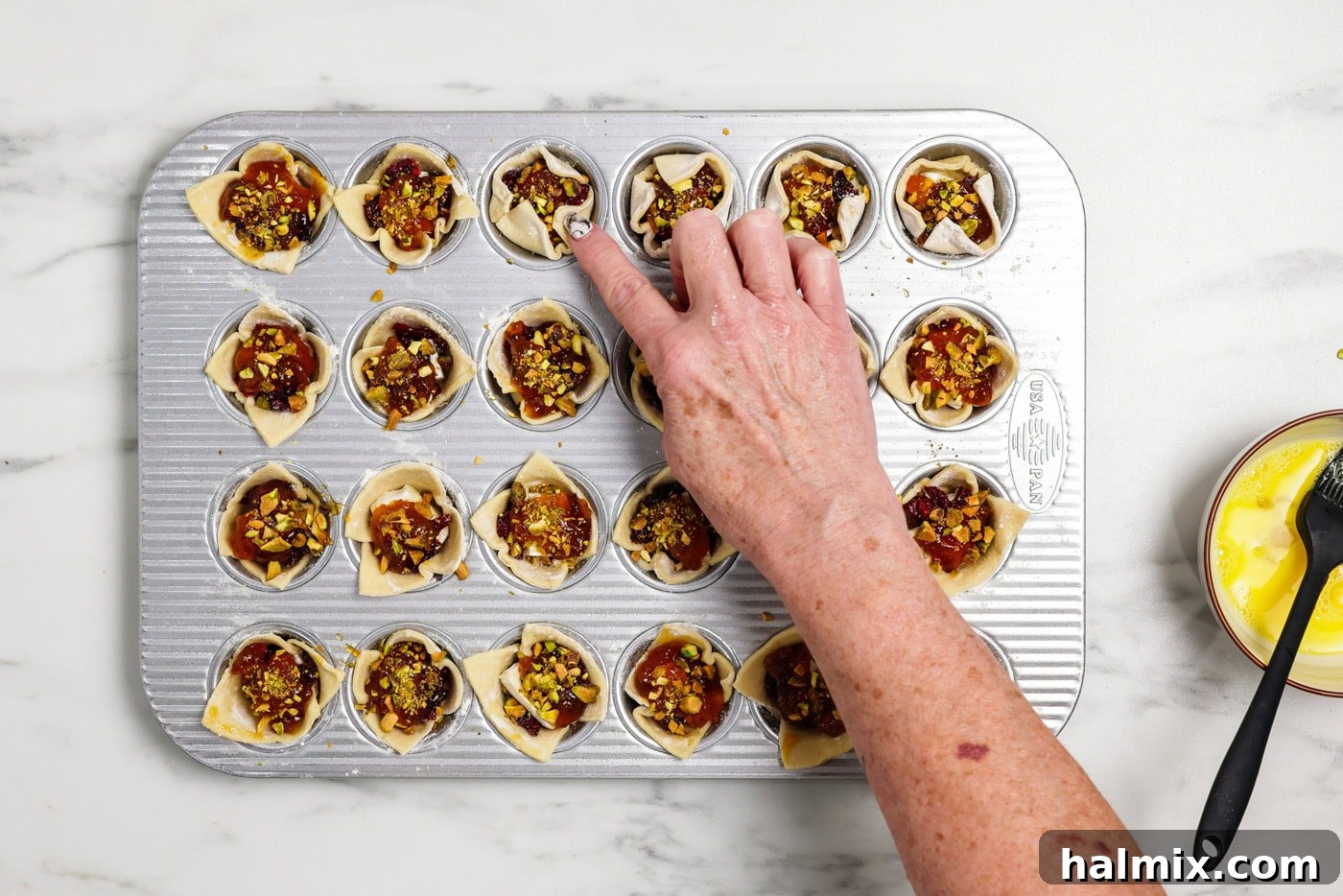 Petite Brie 10 finger gently pressing sides of puff pastry inwards