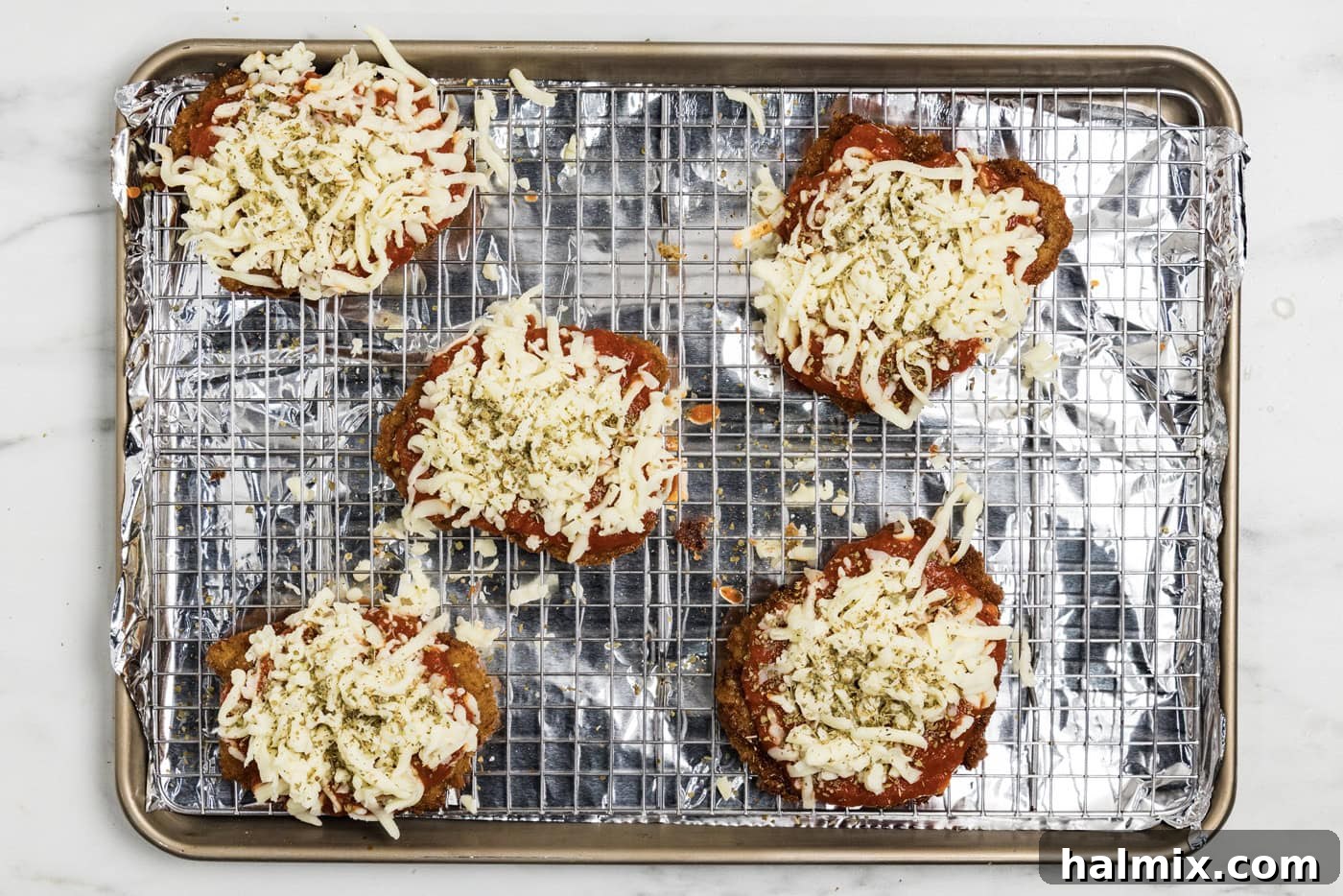 mozzarella cheese on top of marinara fried veal cutlets