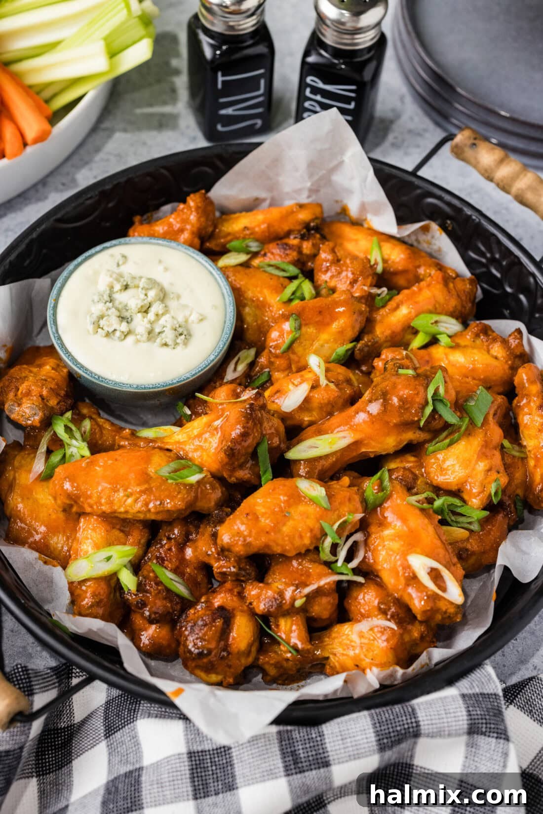 Platter of Buffalo Chicken Wings with a bowl of blue cheese to the side