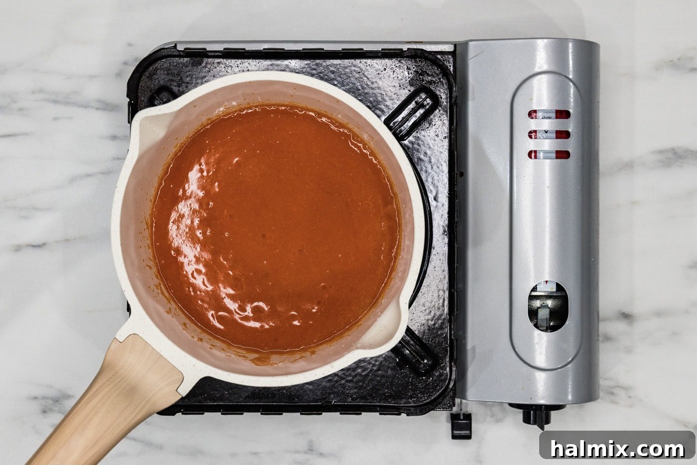 homemade buffalo sauce in a medium saucepan