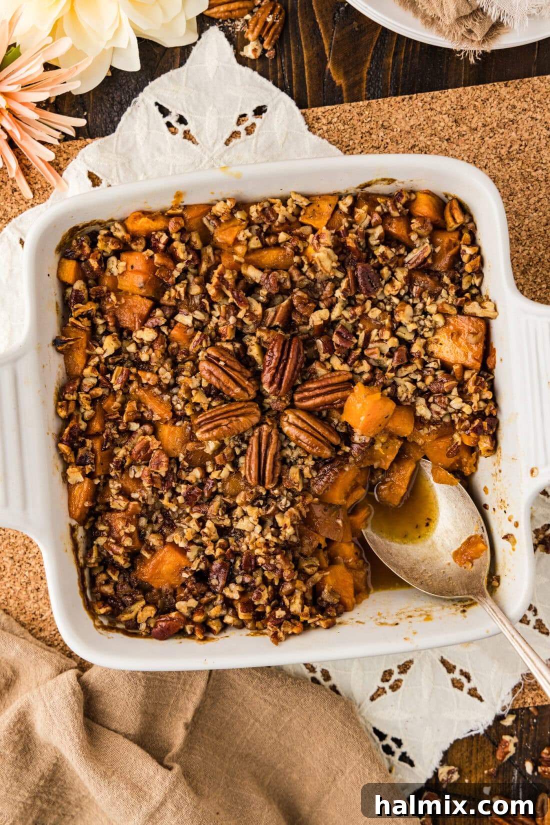 Bourbon Glazed Sweet Potatoes 2 Baking dish of Kentucky Bourbon Sweet Potatoes with a spoon in it