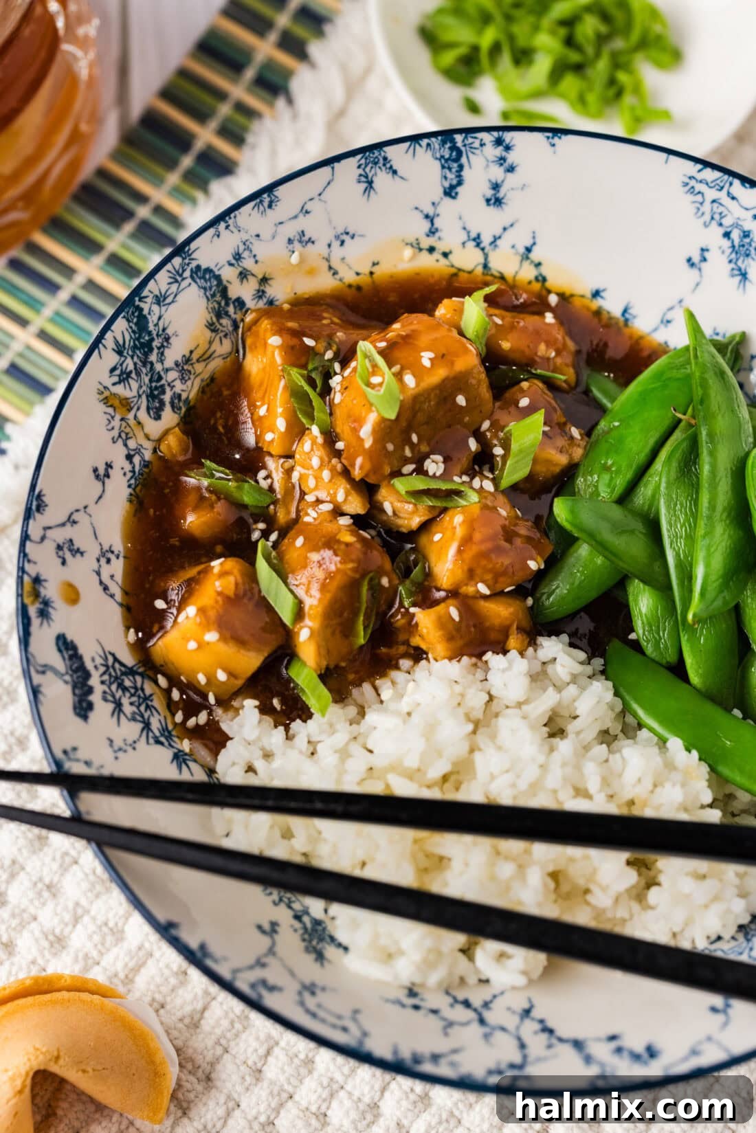 Instant Pot Honey Garlic Chicken in a bowl with rice and peas