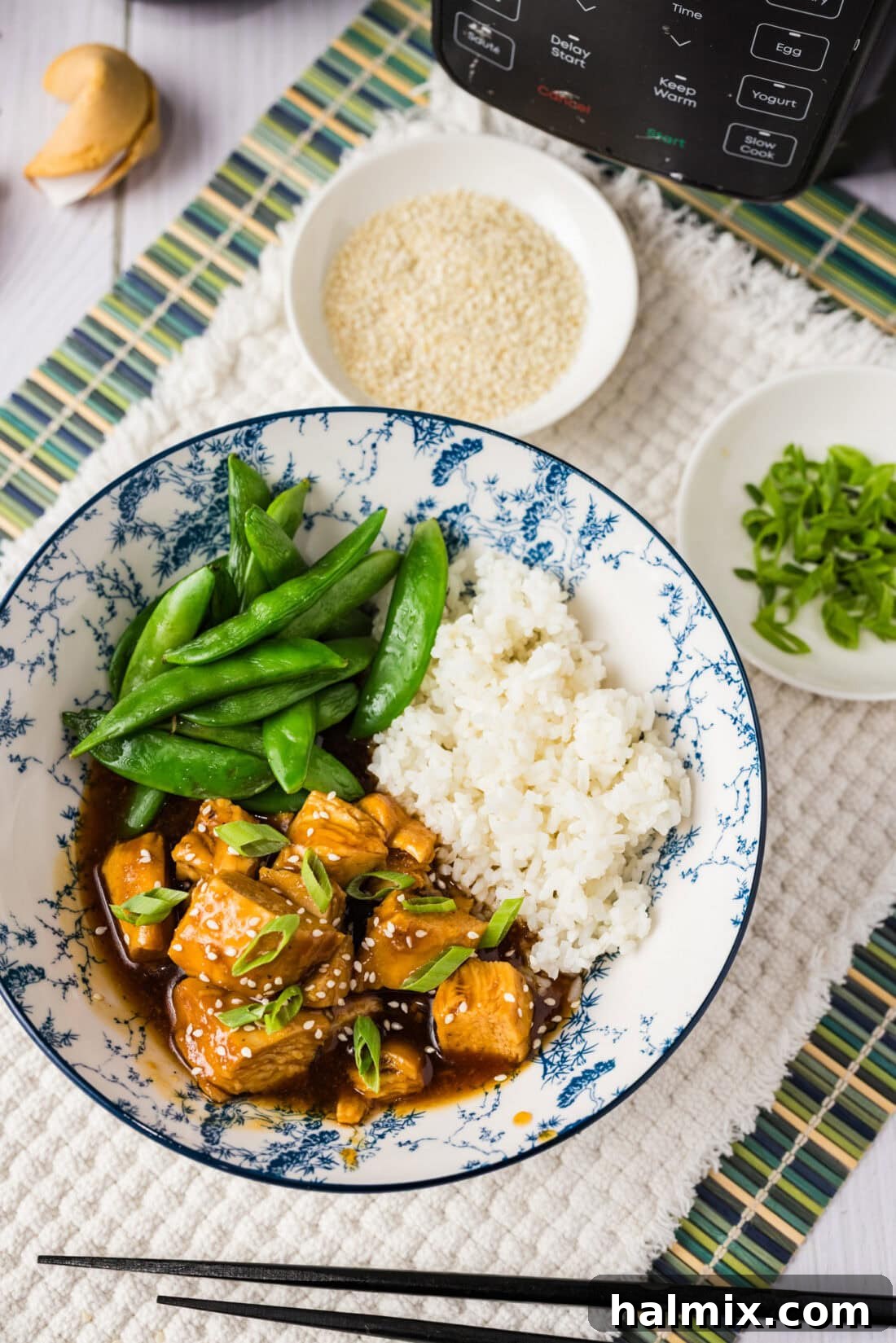 Instant Pot Honey Garlic Chicken, rice and peas in a bowl