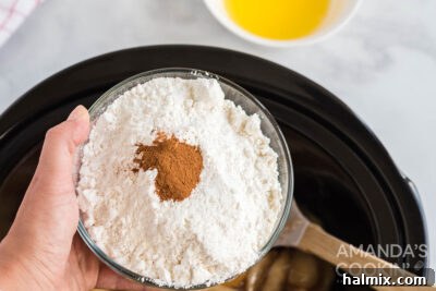 Cozy Crockpot Apple Cobbler 9 cinnamon in a bowl of dry cake mix