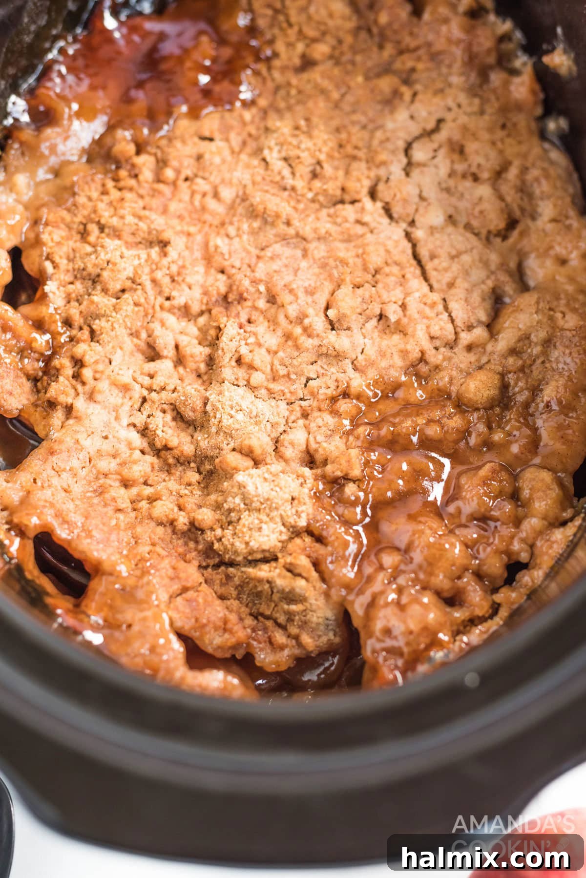 Make crockpot apple cobbler in your slow cooker. This easy crockpot dessert is quick & simple and great any time of year. apple dump cake that has been cooked in a crockpot