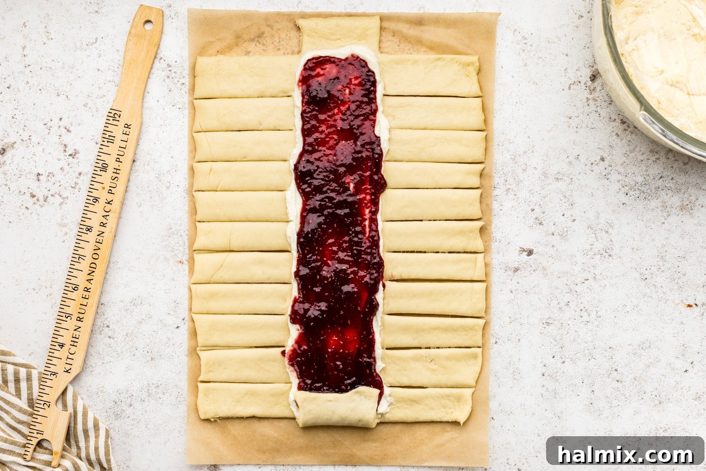 Sweet Braided Morning Pastry 14 strips cut out on sides of dough along the filling lines
