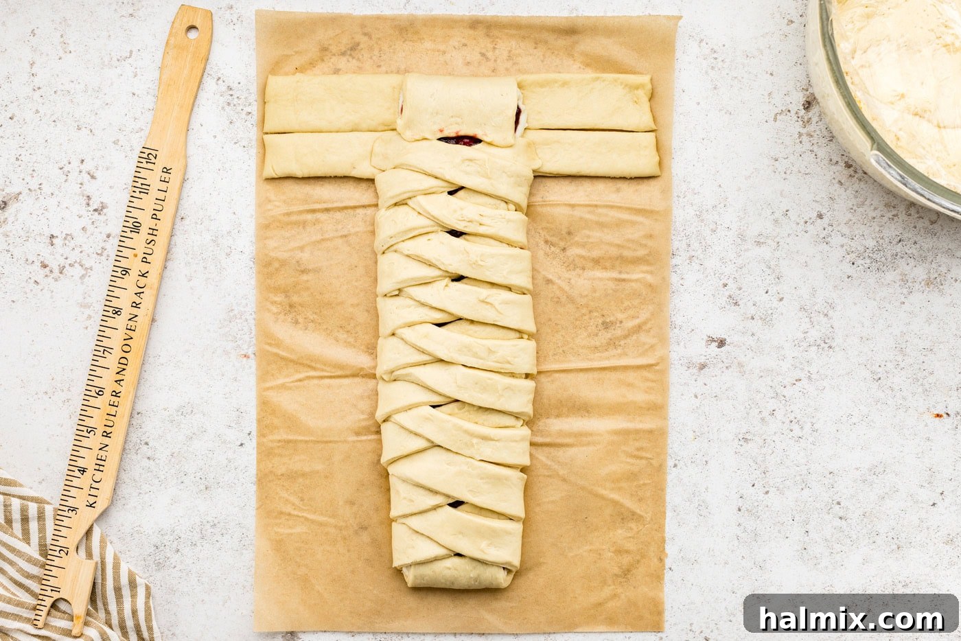 Sweet Braided Morning Pastry 16 folding the end tab of the sectioned dough over the filling