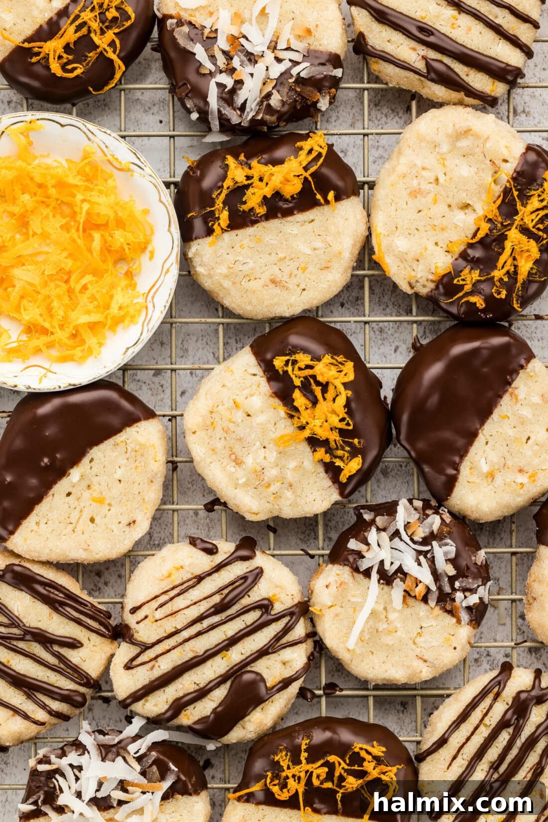 A close-up of several icebox cookies arranged neatly on a wire cooling rack, highlighting their perfect golden color.
