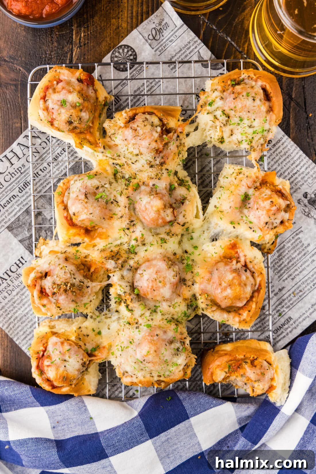 Pocket-Sized Meatball Delights 2 Delicious Meatball Sliders resting on a wire rack, ready to be served as an appetizer.