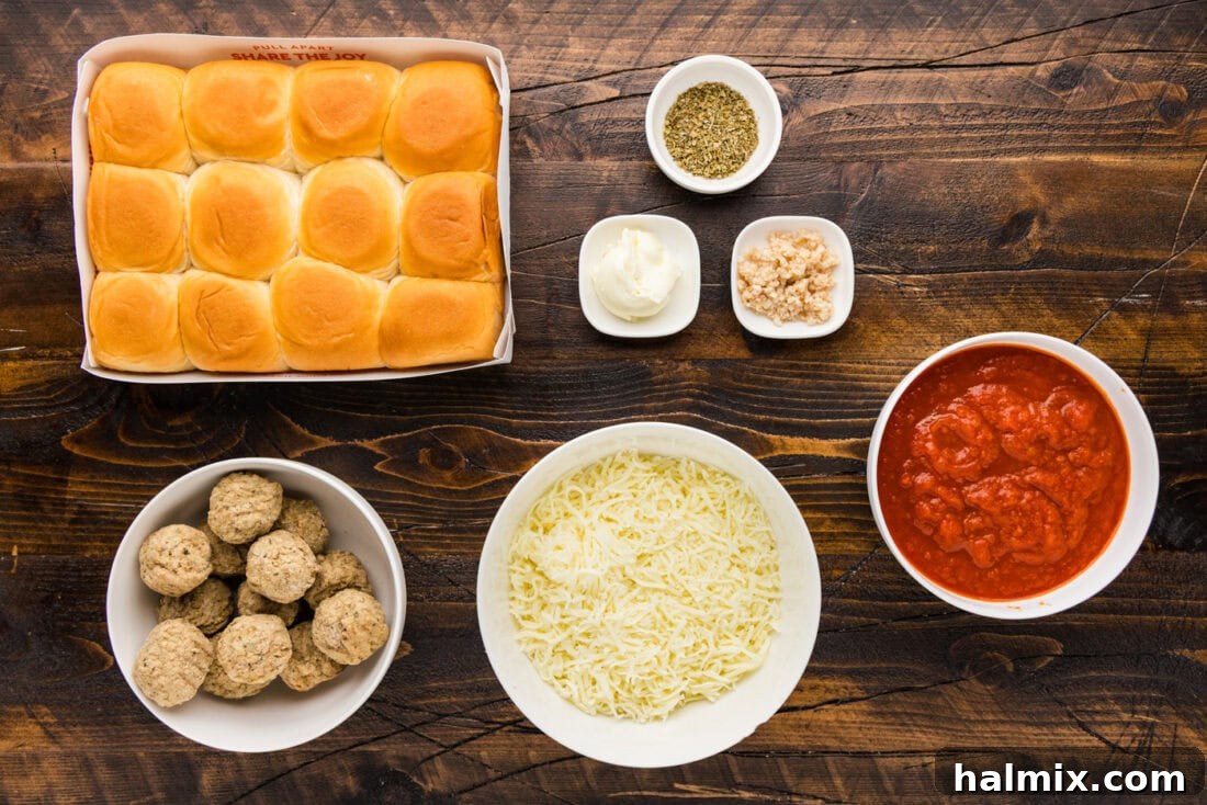 Pocket-Sized Meatball Delights 4 All the fresh and packaged ingredients laid out for making delicious Meatball Sliders, including meatballs, rolls, cheese, and sauce.