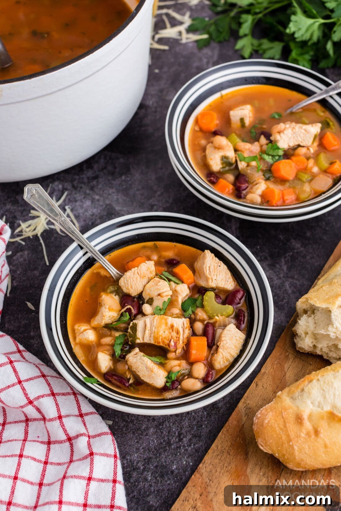 Hearty Chicken Bean Soup 11 Two cozy bowls of chicken bean soup, perfectly presented on a wooden table, ready to be enjoyed.