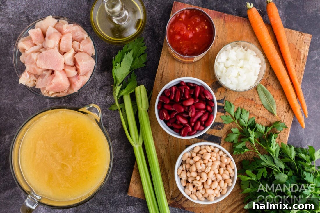 Hearty Chicken Bean Soup 4 A flat lay photograph displaying all the fresh and canned ingredients meticulously laid out for making the chicken bean soup.