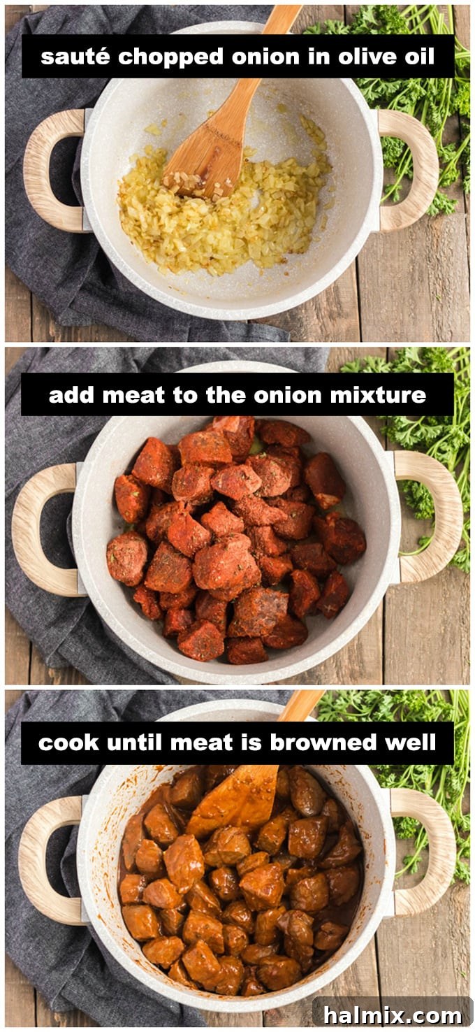 cooking onion and beef chunks in pan